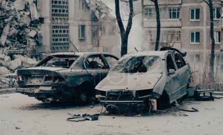 Photo for Damaged and looted cars in a city in Ukraine during the war with Russia - Royalty Free Image