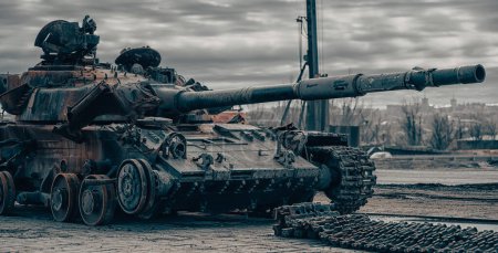 Photo for Damaged military tank on the city street war in Ukraine with Russia - Royalty Free Image