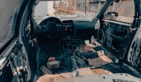 damaged and looted cars in a city in Ukraine during the war with Russia