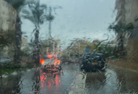 Photo for First raFirst rains. View from the window to a blurry image through the glassins. View from the window to a blurry image through the glass - Royalty Free Image