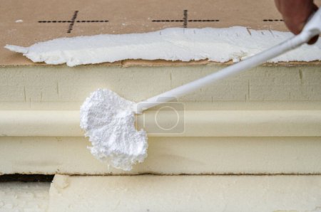 Photo for Spray foam and rigid insulating foam board. The reduced energy use. - Royalty Free Image