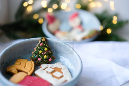 Photo for Christmas gingerbreads in the ceramics bowl. Bokeh. Copy space. Shallow depth of field. - Royalty Free Image