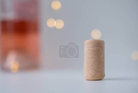 Photo for Synthetic wine cork. Bottle of rose wine. Bokeh. Copy space. - Royalty Free Image