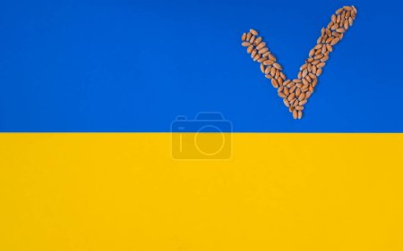 Ukrainian wheat. Check mark symbol. Yellow and blue background. Ukrainian flag.