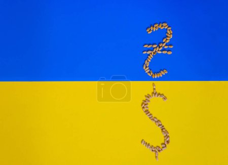 Ukrainian currency symbol (Ukrainian hryvnia). American dollar symbol. Wheat grain. Ukraine Flag. Grain deals and world trade. Copy space.