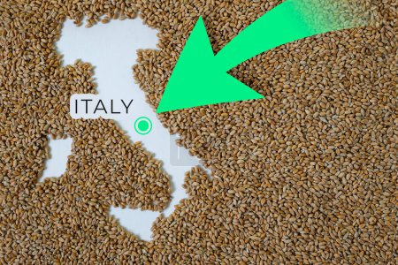 Map of Italy filled with wheat grain. Direction green arrow. Copy space.