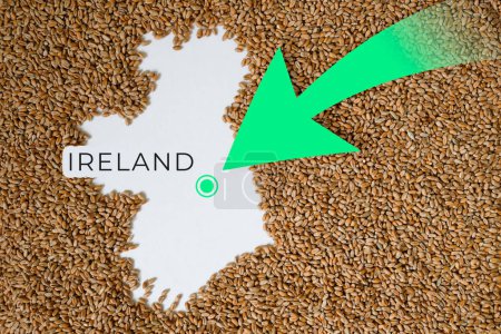 Map of Ireland filled with wheat grain. Direction green arrow. Space for text.