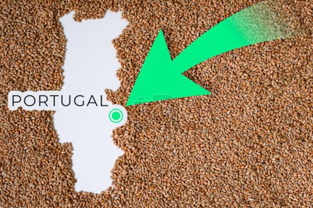 Map of Portugal filled with wheat grain. Direction green arrow. Copy space.
