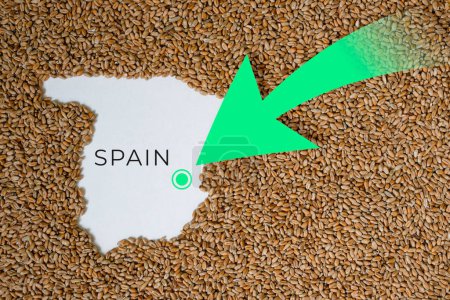 Map of Spain filled with wheat grain. Direction green arrow. Space for text.
