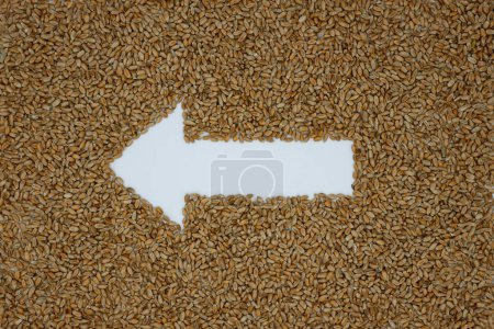 Wheat. Left Arrow. Grain background. Grain supply. Agricultural independence.