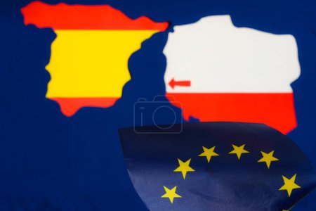 Photo for Euro Union flag. Blurred Poland and Spain maps. Arrow. Population migration from Poland to Spain. - Royalty Free Image