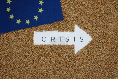 Wheat. Right Arrow. The word Crisis. Grain background. European Union flag. Grain crisis.