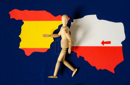 Model of the human goes. Poland map. Spain map. Arrow. Population migration from Poland to Spain. Blue background of European Union Flag.