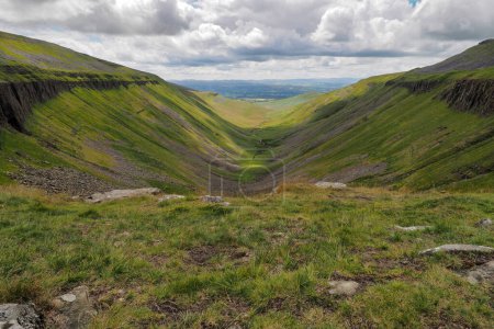 Photo for Dramatic view from the edge of High Cup Nick down the High Cup Gill chasm, Eden Valley, North Pennines, Cumbria, UK - Royalty Free Image