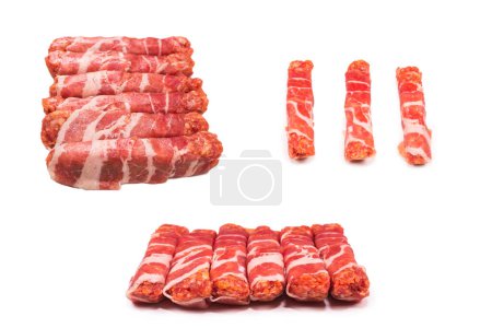 Photo for Chevapchichi in bacon isolated on white background. - Royalty Free Image