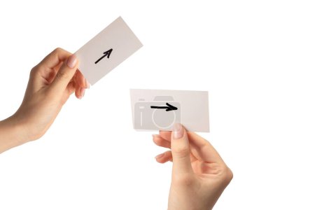 Arrow sign on a card in a woman hand isolated on a white background.