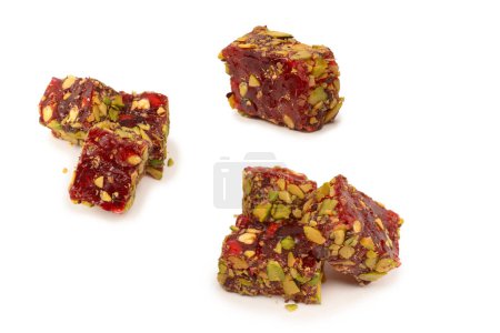 Sweet roll with pomegranate and pistachios, turkish sweets. Turkish rahat isolated on a  white background.