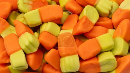 Juicy colorful jelly sweets as a background. Gummy candies. Jelly carrots.