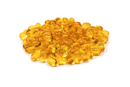 A group of yellow capsules isolated on a white background. 