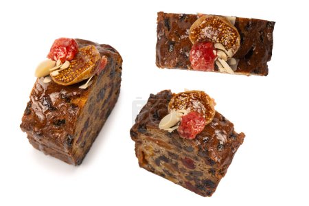 A cake with dried fruits, raisins almonds, dried strawberry, dried apricots.