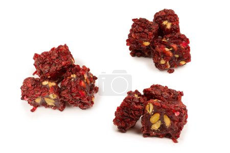 Sweet roll with pomegranate and nuts, turkish sweets. Turkish rahat isolated on a  white background.