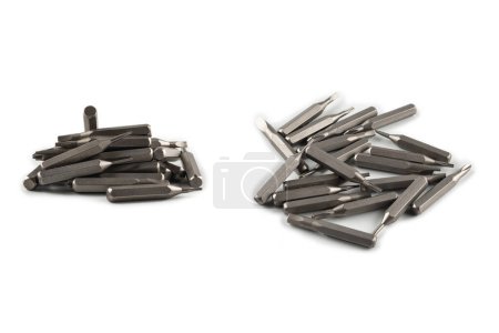 Isolated on a white background tips of a group of phillips head screwdriver bits. Top view. 