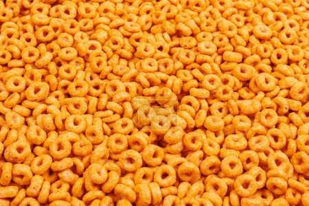 Photo for Corn-flakes background and texture. Top view. Honey rings cereal box for morning breakfast. - Royalty Free Image