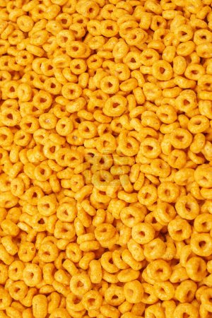 Photo for Corn-flakes background and texture. Top view. Honey rings cereal box for morning breakfast. - Royalty Free Image