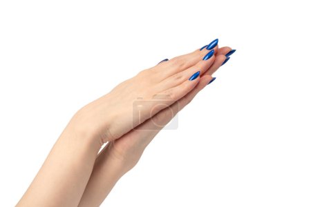Photo for Hand of a woman with blue nails isolated on a white background. - Royalty Free Image