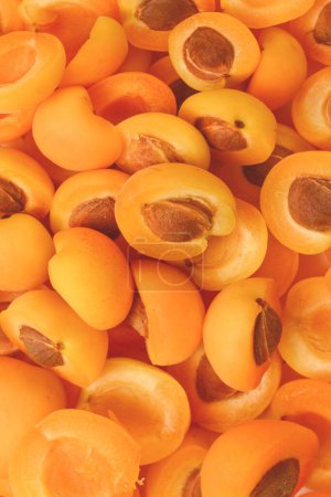 Photo for Ripe juicy orange apricots slices fruit background. - Royalty Free Image