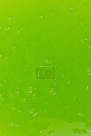 Green slime toy as a background. Top view. 
