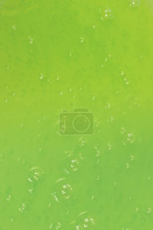 Green slime toy as a background. Top view. 