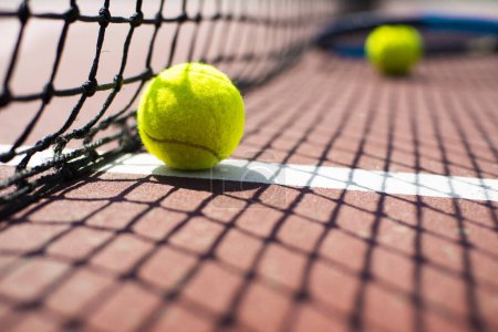 Photo for Tennis ball lying on the court. Healthy lifestyle concept - Royalty Free Image