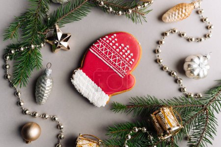 Photo for Glove cookie on christmas decorated table - Royalty Free Image