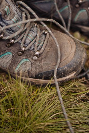 Photo for Hiking boots on the ground - Royalty Free Image
