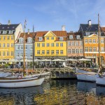 Sailing boats at quay in the Nyhavn neighborhood of Copenhagen, Denmark