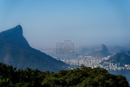 Overlooking Rio de Janeiro, the photo captures stunning Sugarloaf Mountain and the famed Christ the Redeemer.