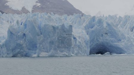 Boat tour video displays the grandeur of Perito Moreno Glaciers walls and ice tunnels in slow-mo.