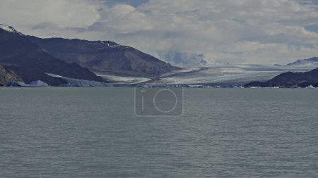 Boat tour on Lago Argentino showcasing the majestic Upsala Glacier, an emblem of natures splendor and environmental shifts.