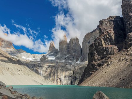 Enchanting turquoise glacial lake flanked by soaring mountain peaks, torres del paine