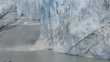 Video shows glacier ice chunks falling into the sea.