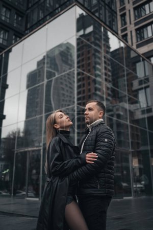 Photo for A couple in love in the central metropolis of Ukraine. Love story on the background of skyscrapers - Royalty Free Image