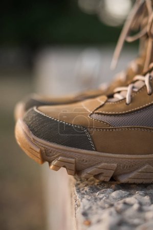 Photo for High-top lace-up sneakers in military color. Tactical army specialized sneakers for field conditions - Royalty Free Image