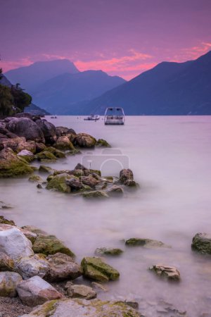 Photo for Pink colors of the sky during sunrise over Lake Garda - Royalty Free Image