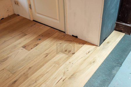 Photo for Newly laid parquet floor with insulation floor. - Royalty Free Image