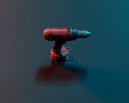 Photo for Red electric hand drill in red and blue coloured light against blue background. Studio shot. High angle view. - Royalty Free Image