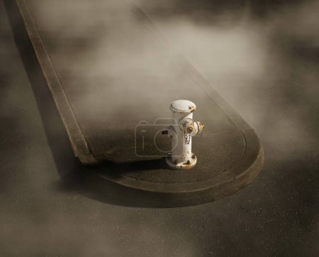 Photo for White iron rusty fire hydrant on a sidewalk on a foggy street. High angle view. - Royalty Free Image