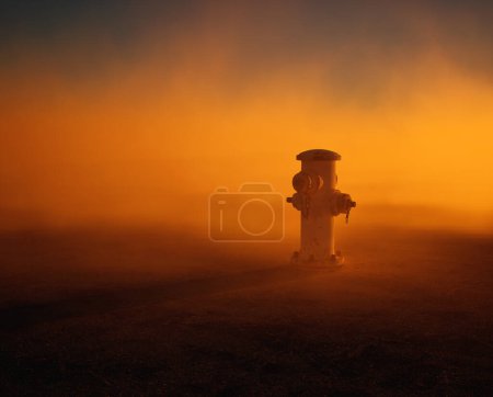 Photo for Fire hydrant supply on cracked tarmac street in mist at sunset. - Royalty Free Image