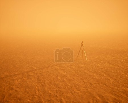 Téléchargez les photos : Arpenteur-géomètre sur trépied debout sur un grand paysage plat ouvert dans la brume pendant le coucher du soleil. - en image libre de droit