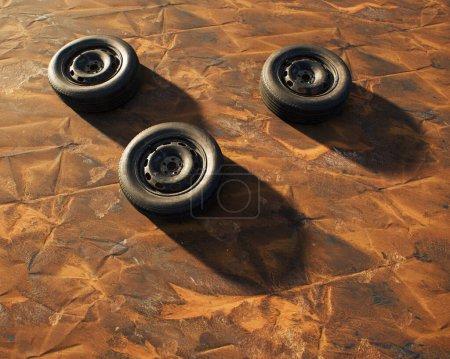 Photo for Three old car wheels on weathered rusty painted metal sheet. - Royalty Free Image